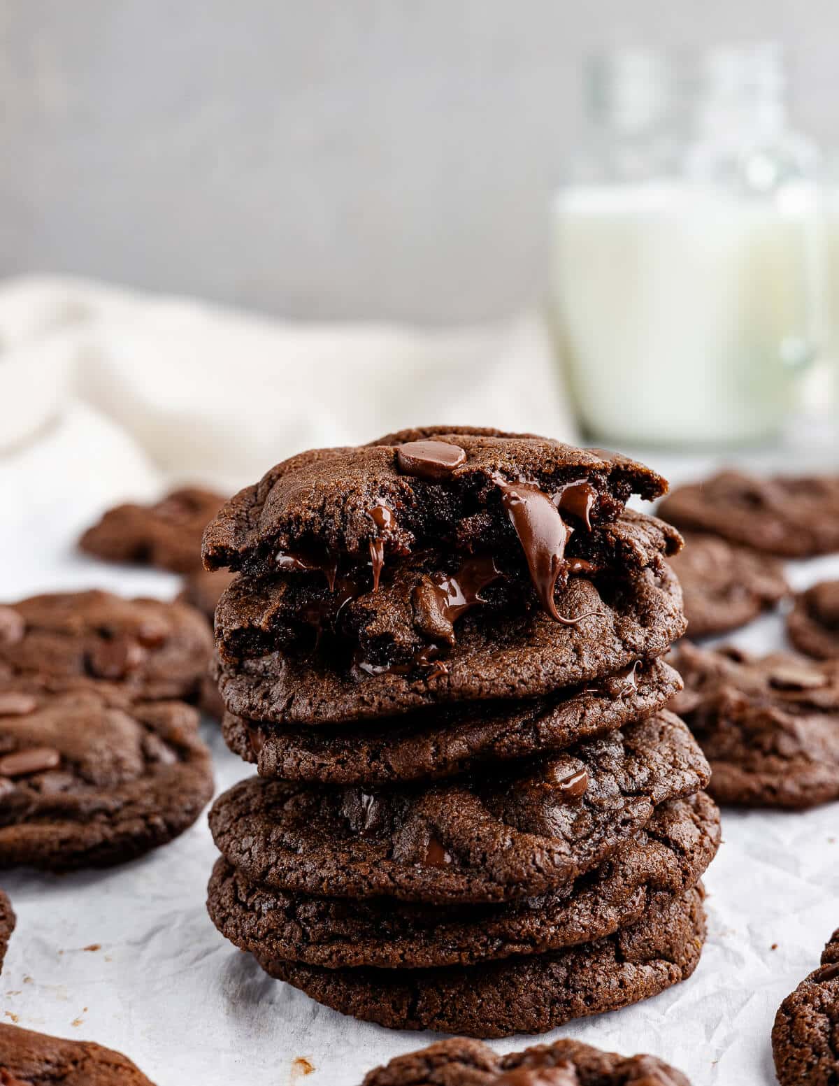 a stack of chocolate cookies with melted chocolate oozing out.