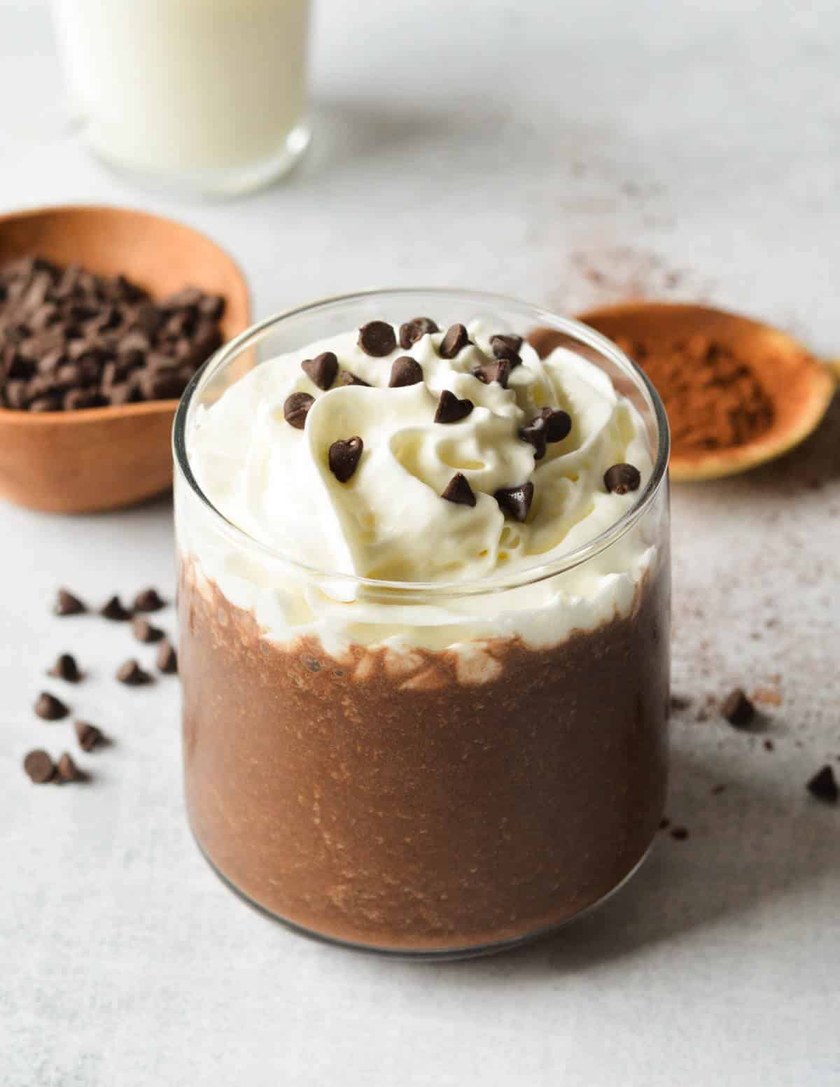 mocha smoothie with whipped cream and chocolate chips on top.