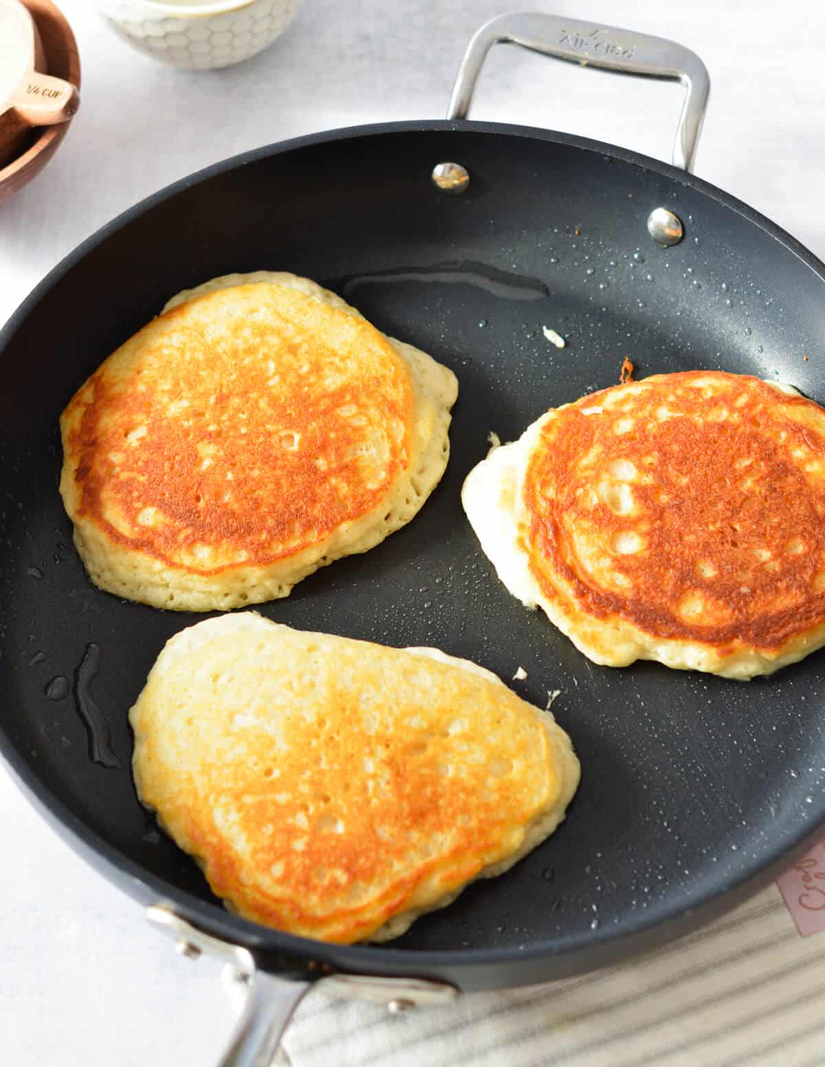 golden brown pancakes in a skillet.