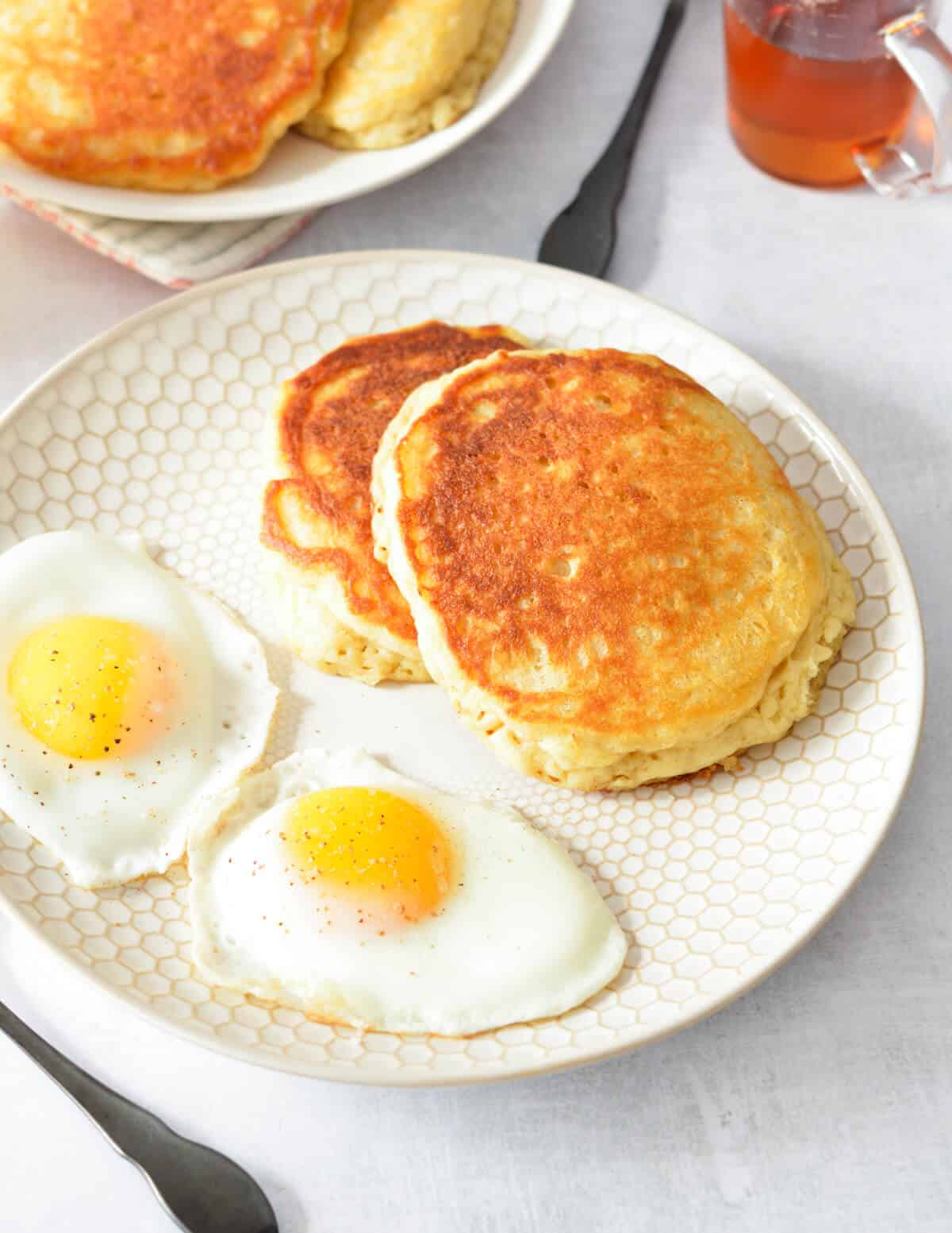 a plate of pancakes and eggs.