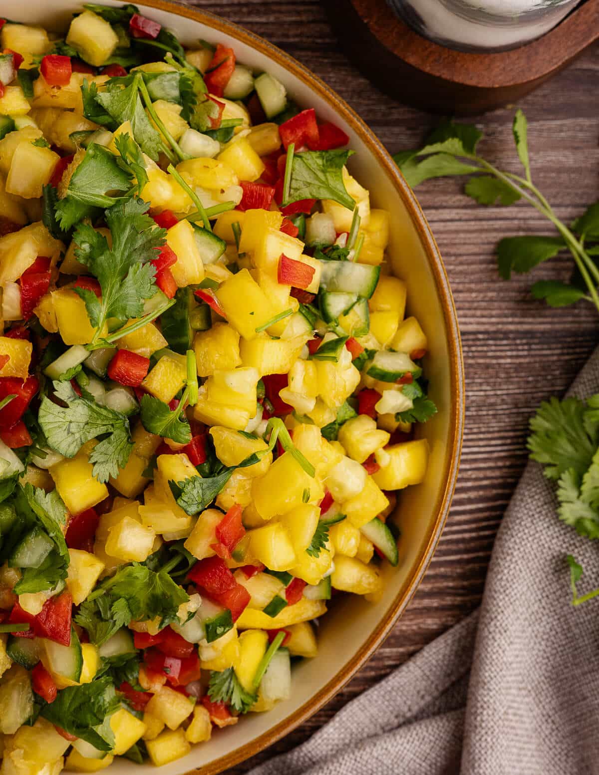 close up of pineapple mango salsa in a bowl.