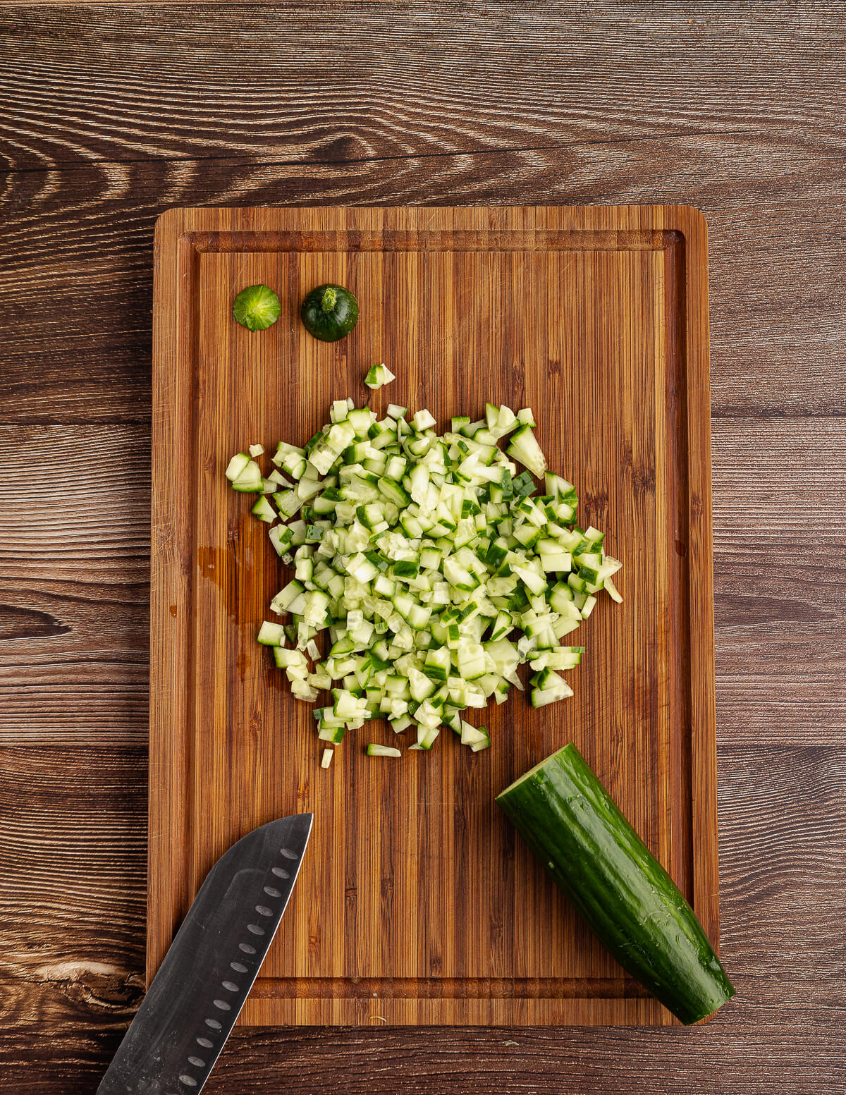 diced cucumber on a cutting board.