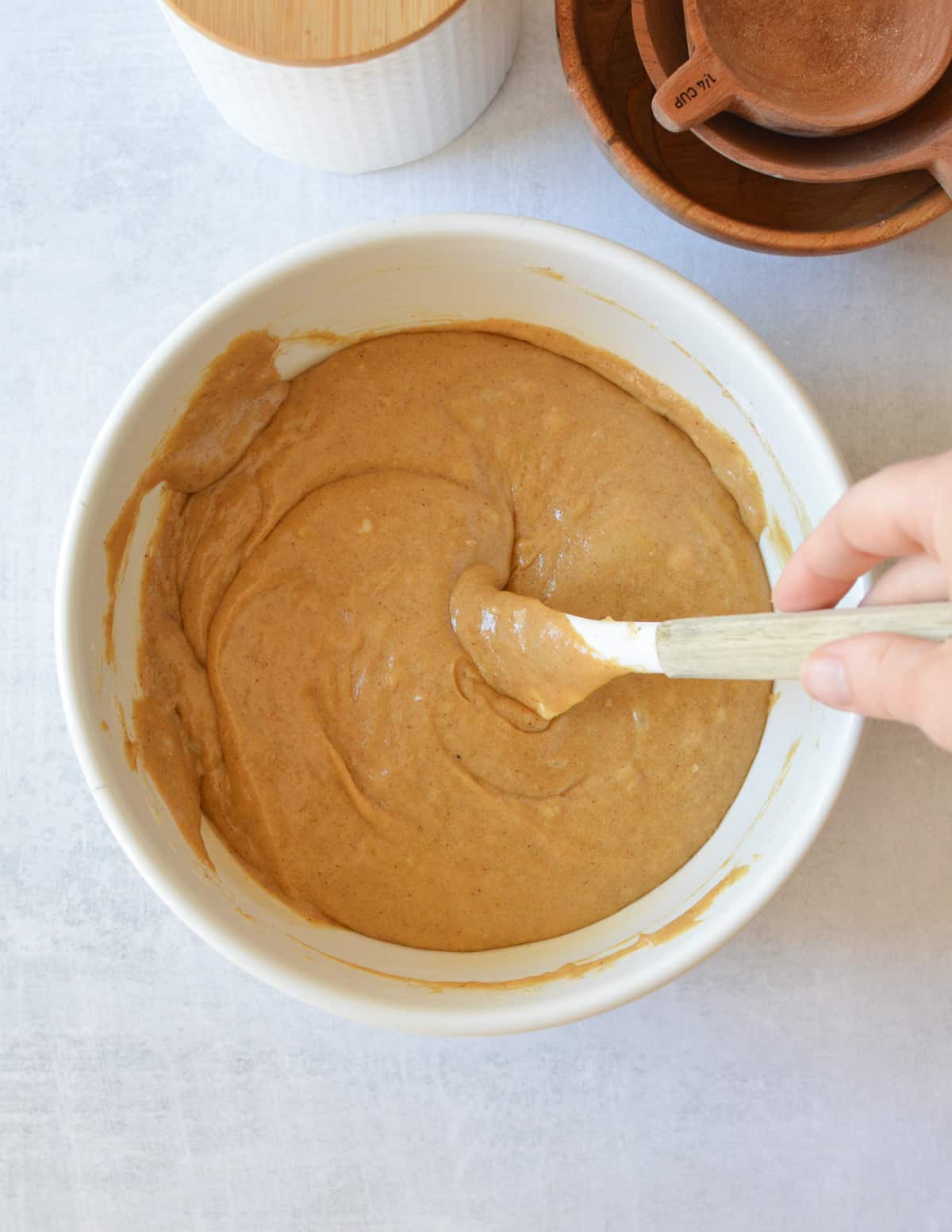 a bowl of gluten free gingerbread cake batter