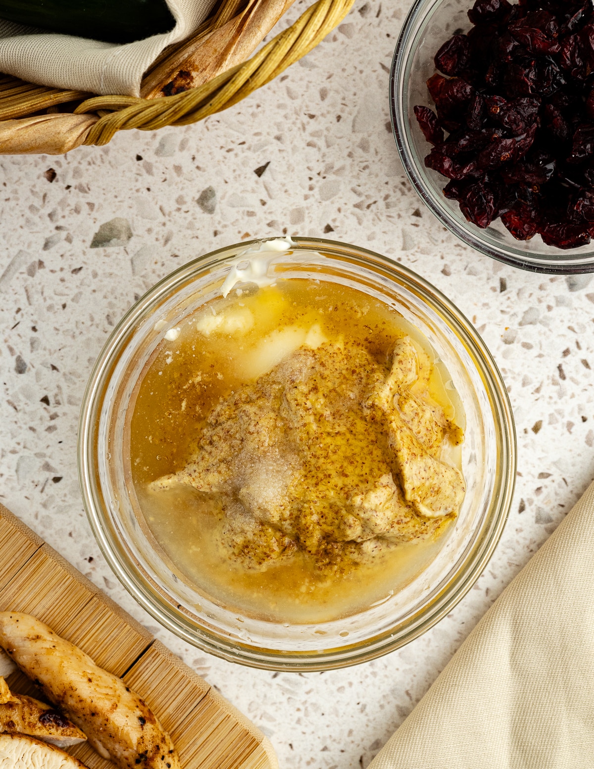 a bowl with mayo, mustard, honey, lemon juice, and salt in it.