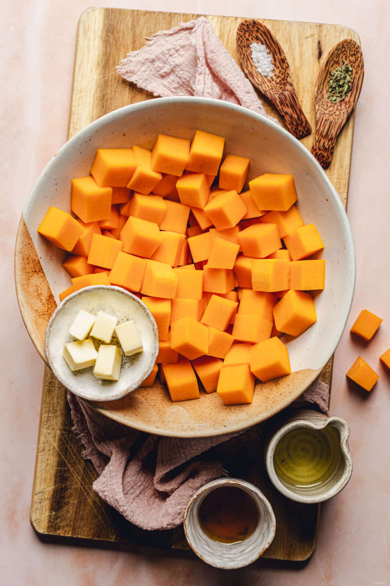 butternut squash cubes, salt, thyme, butter, olive oil, maple syrup.