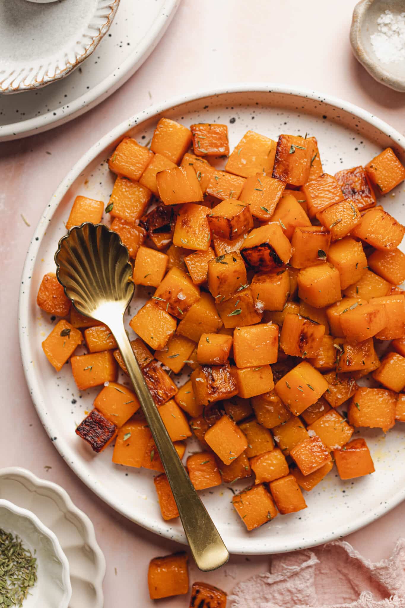 a plate of caramelized butternut squash cubes