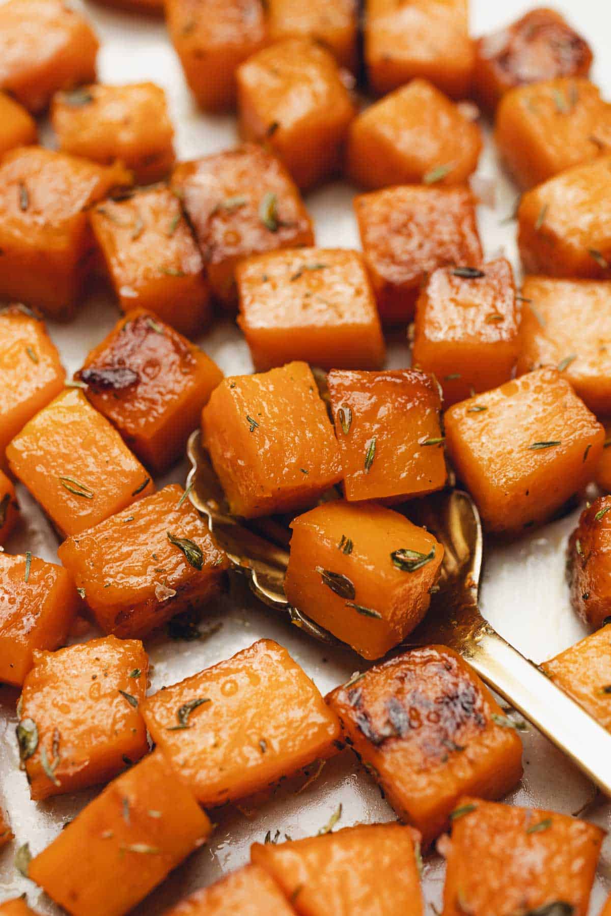Close up of sauteed butternut squash with thyme