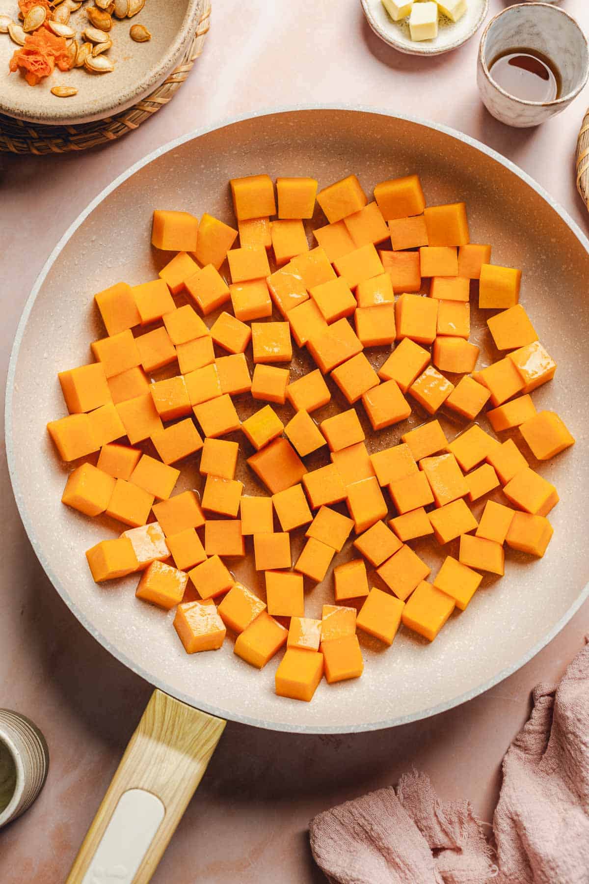 butternut squash cubes in a skillet.
