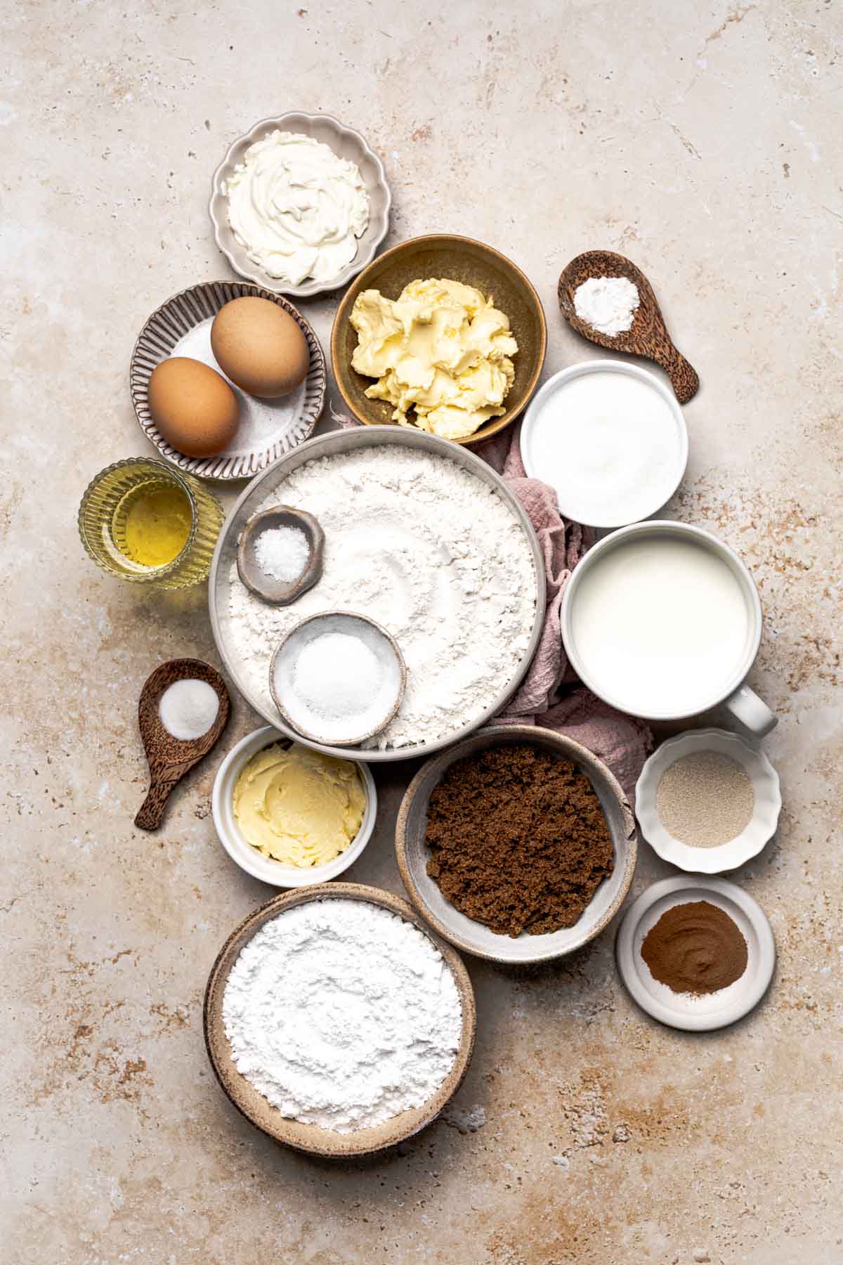 eggs. butter, cream cheese, vegetable oil, salt, cinnamon, brown sugar, powdered sugar, yeast, and gluten-free flour.