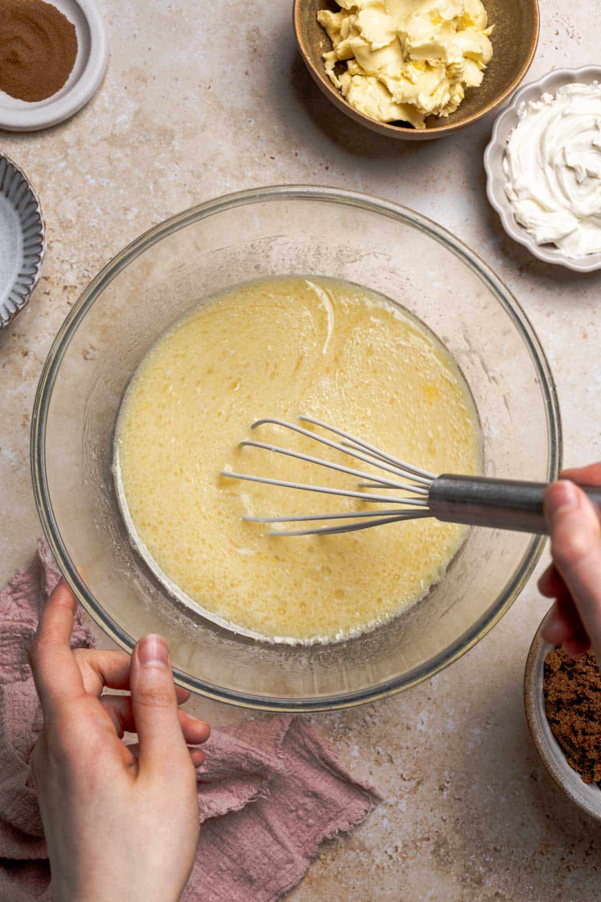 a bowl of milk, yeast, eggs, oil, and sugar whisked together.