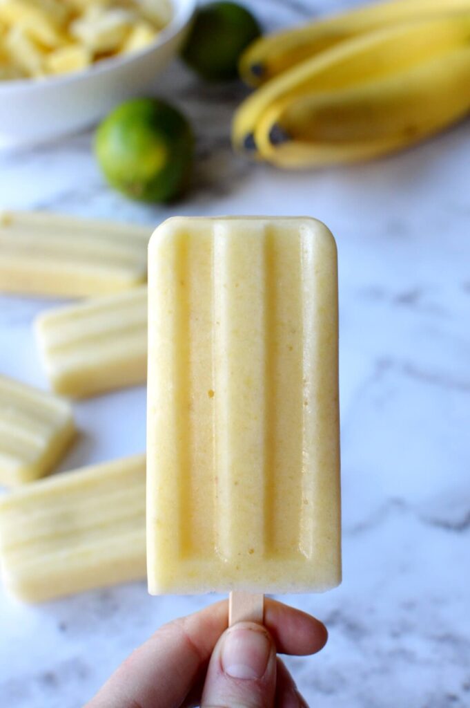 A close up of a pineapple popsicle