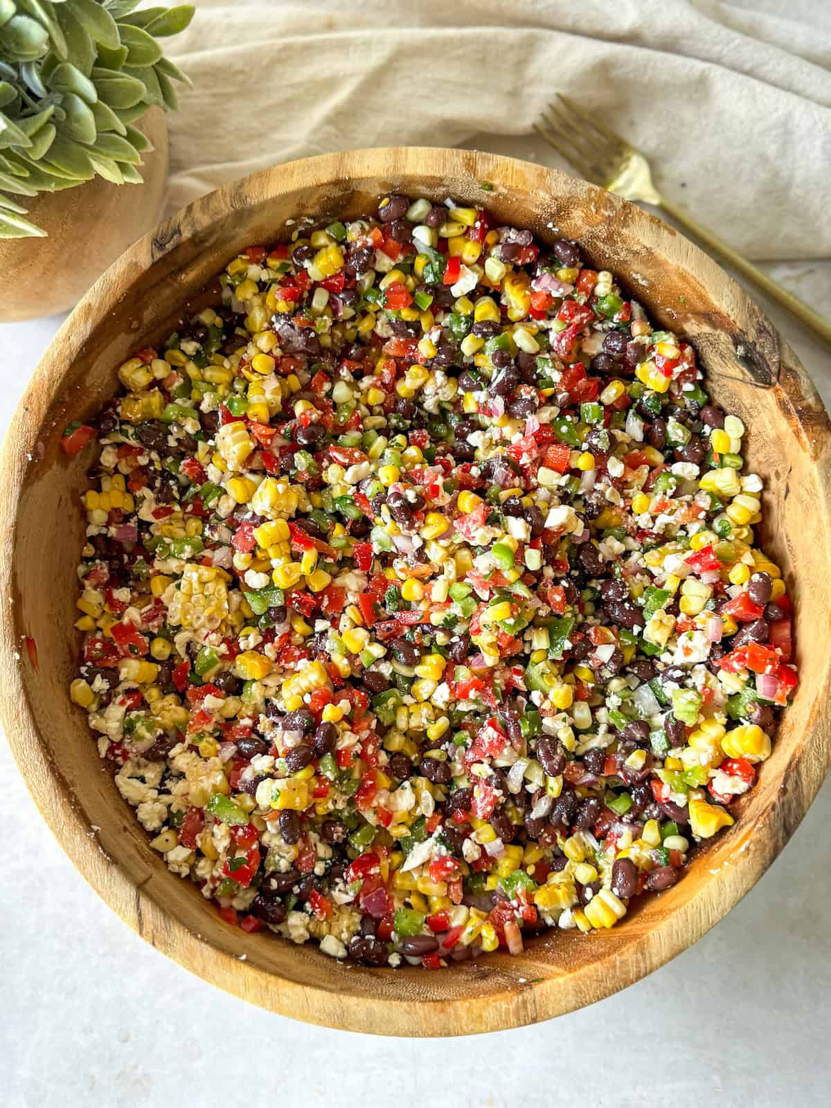 a bowl of black bean and corn dip 