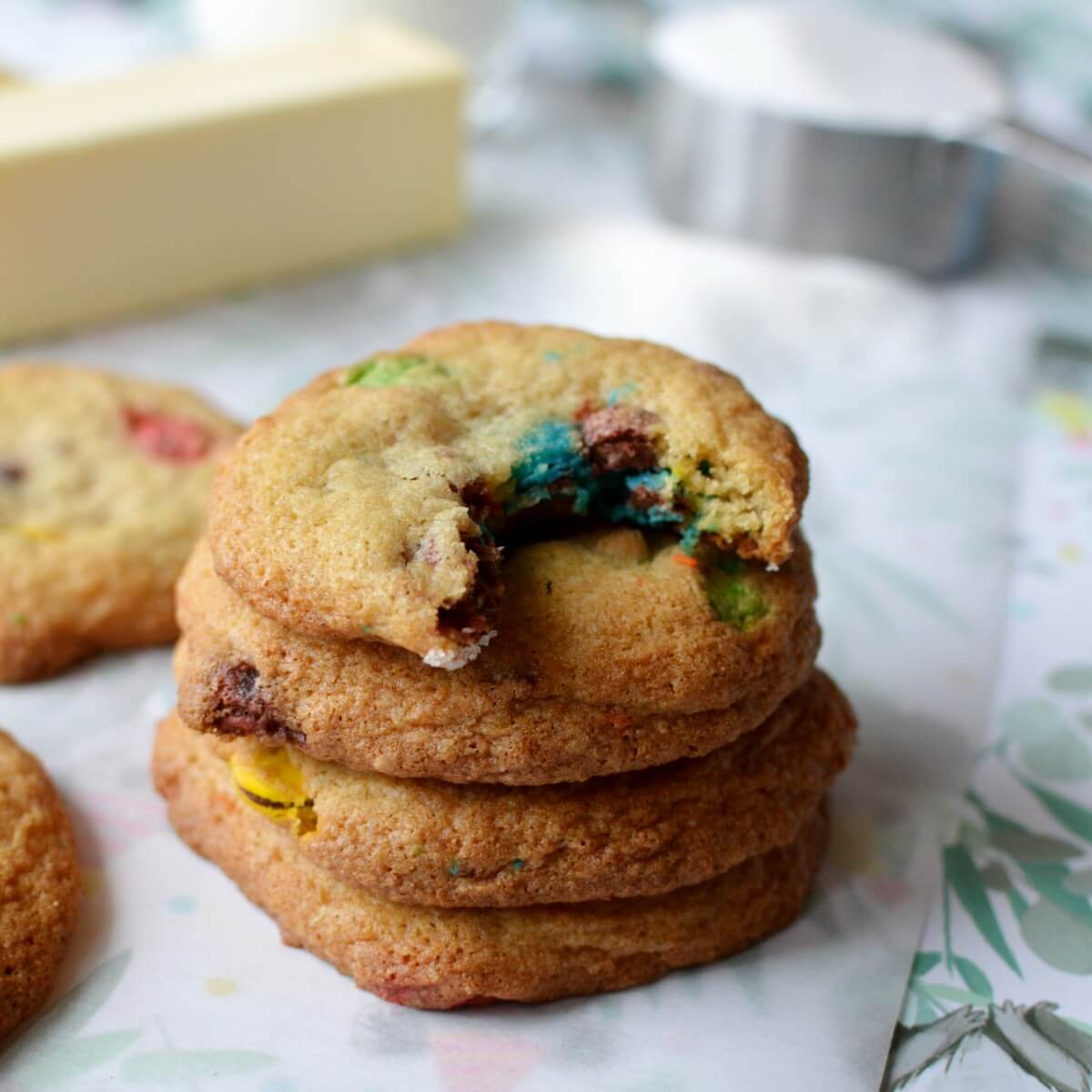 A stack of gluten free cookies with a bite out of the top cookie.