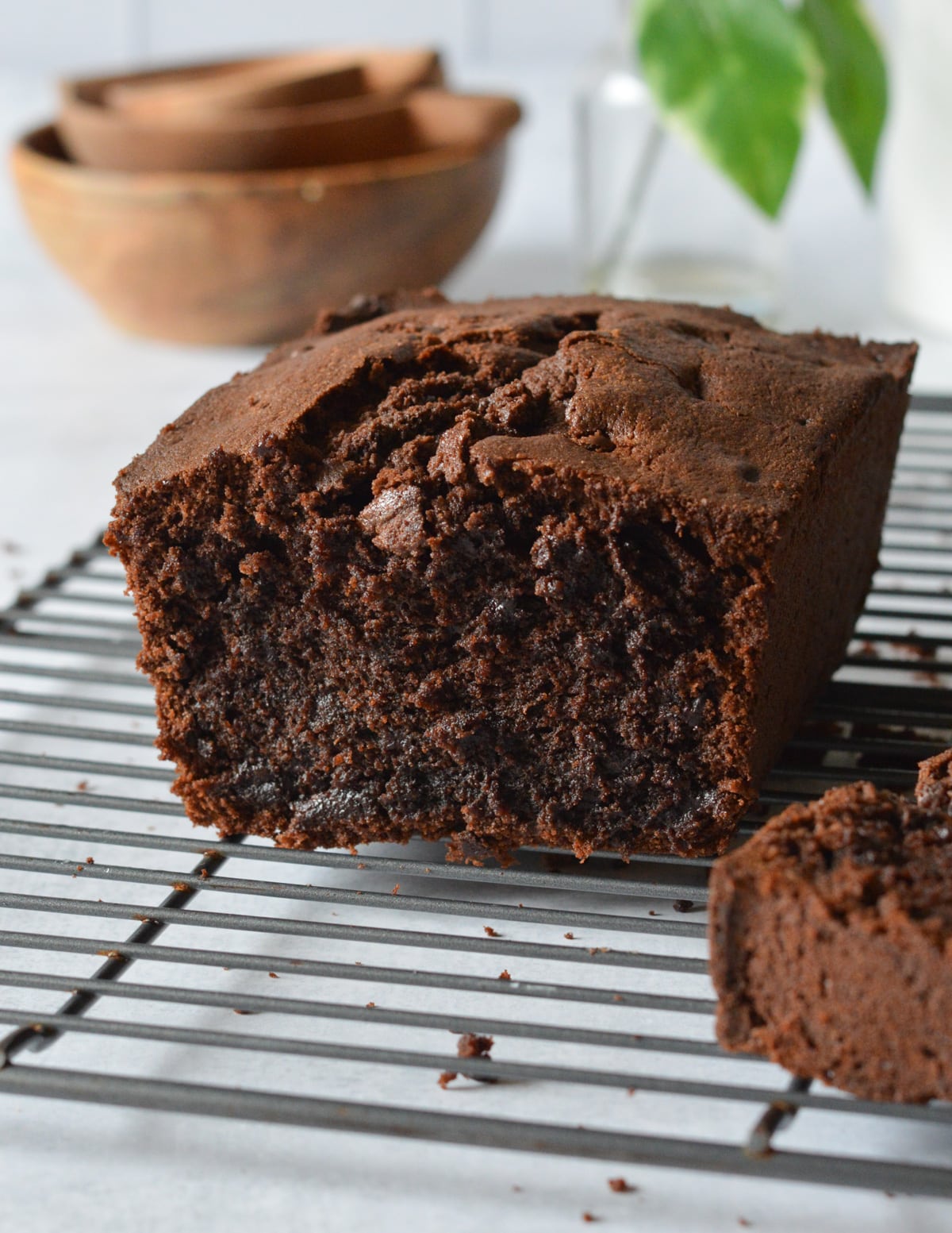 gluten free chocolate pound cake on a wire rack.