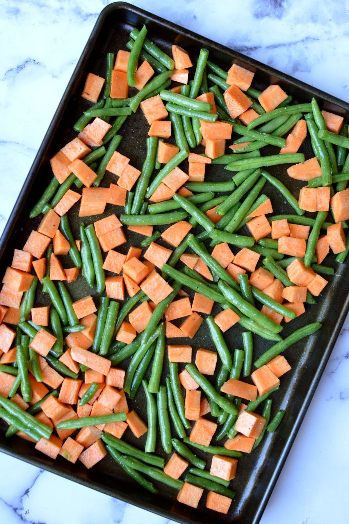 cut up veggies on a sheet pan