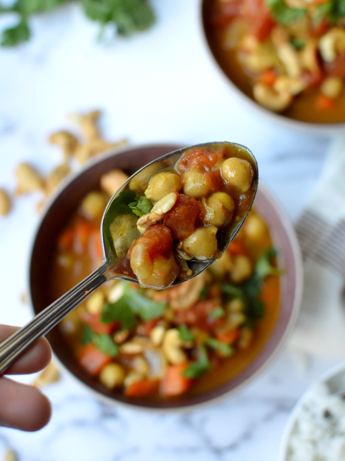 a spoonful of chickpeas and tomatoes