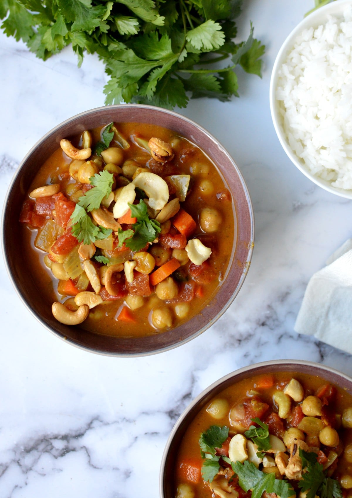 a bowl of chickpea curry with cashews