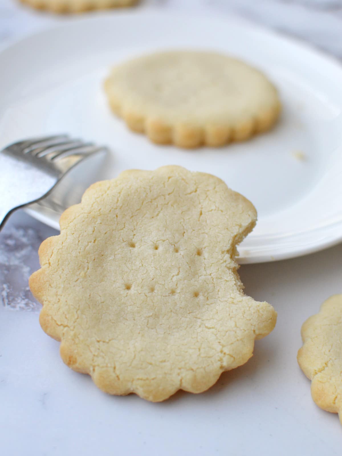 a gluten-free shortbread cookie with a bite out of it