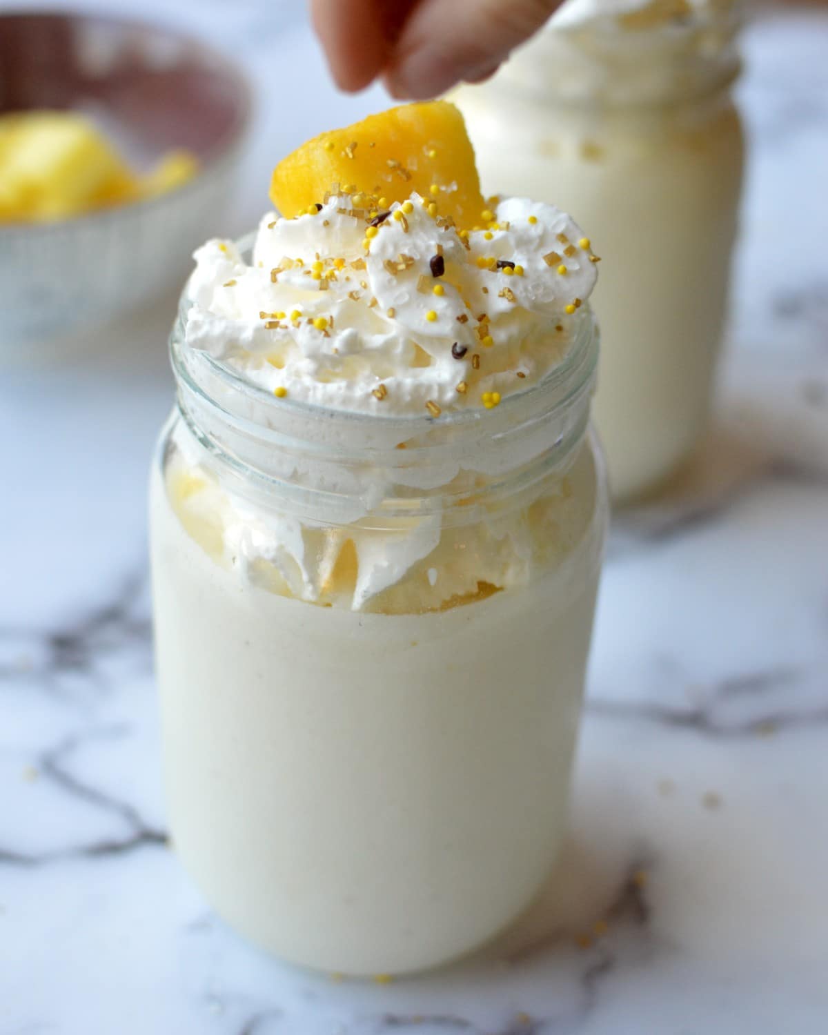 a pineapple shake with whipped cream