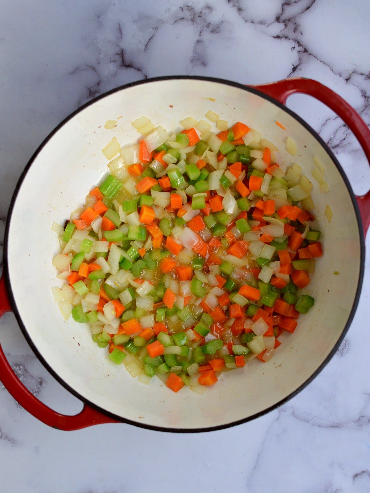 carrots, onion, and celery in dutch oven