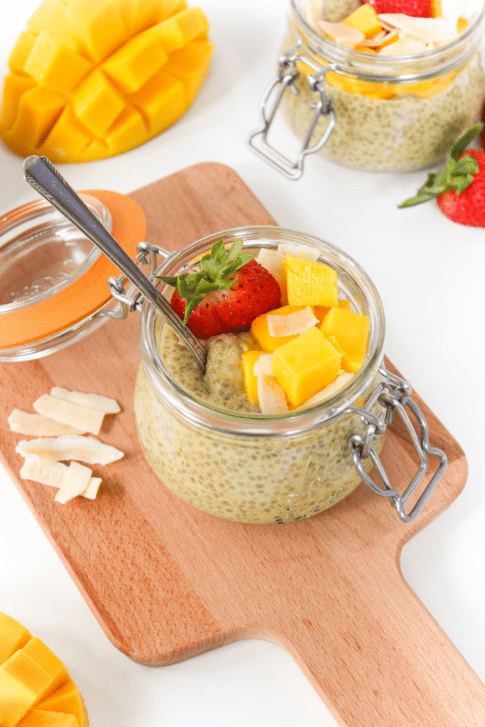 a jar of chia pudding with mango