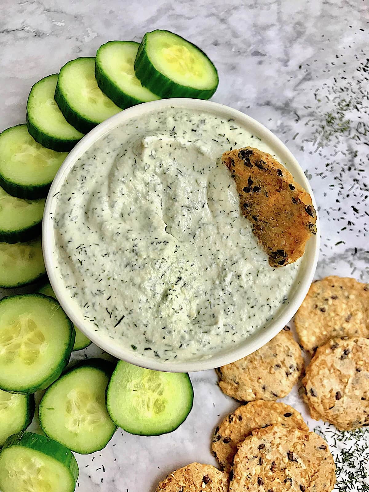 a bowl of vegan tzatziki