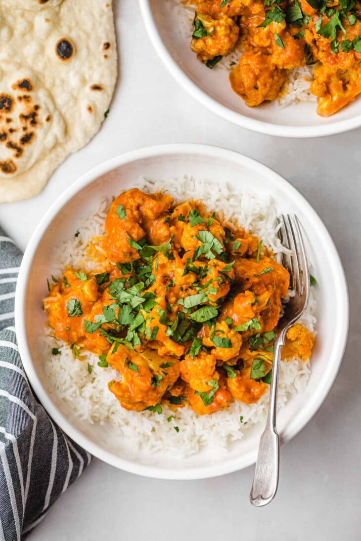 cauliflower in curry sauce on top of rice