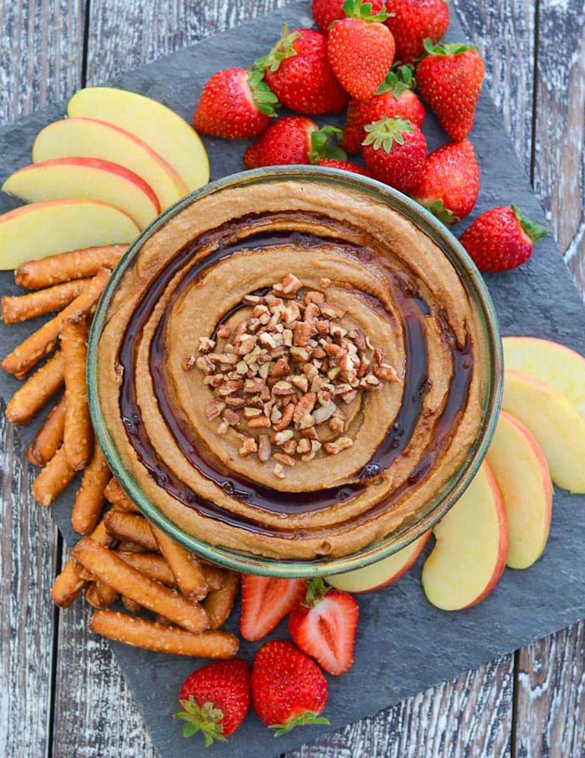 snickerdoodle hummus with pecans on top