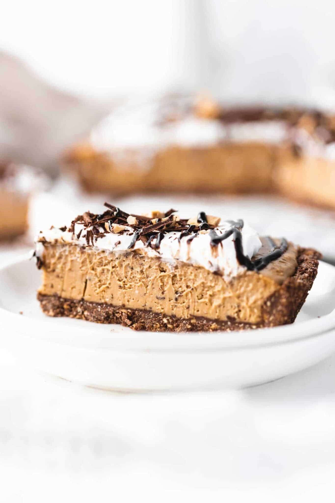 a slice of vegan peanut butter pie with chocolate flakes