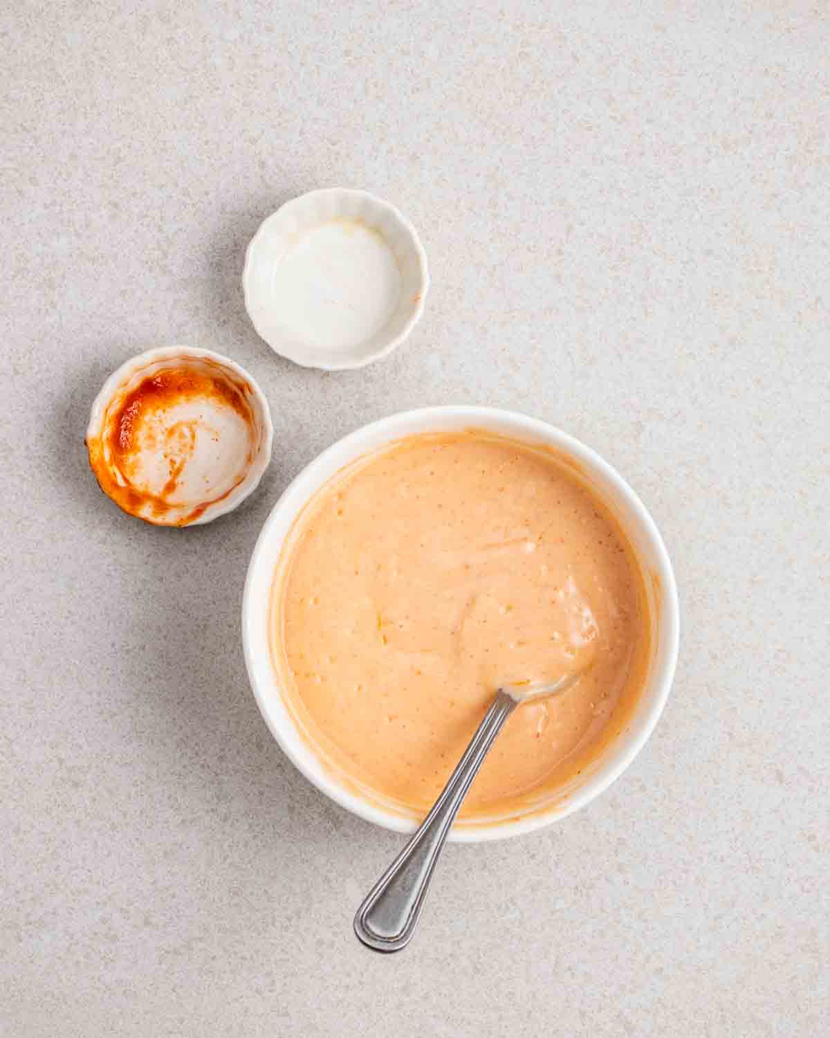 a ramekin of vegan siracha mayo