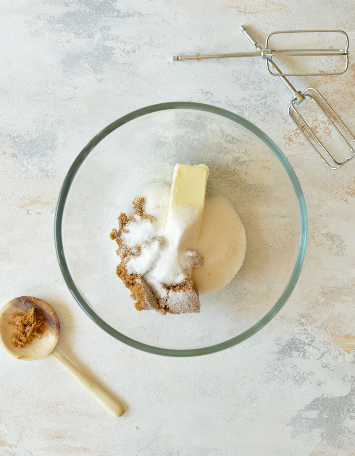 butter, sugar, and brown sugar in a bowl