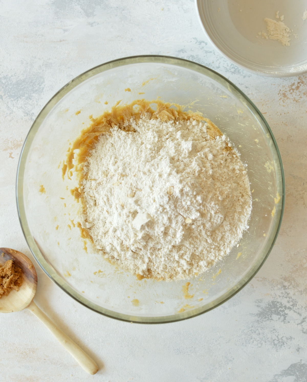 creamed butter and sugar with flour on top