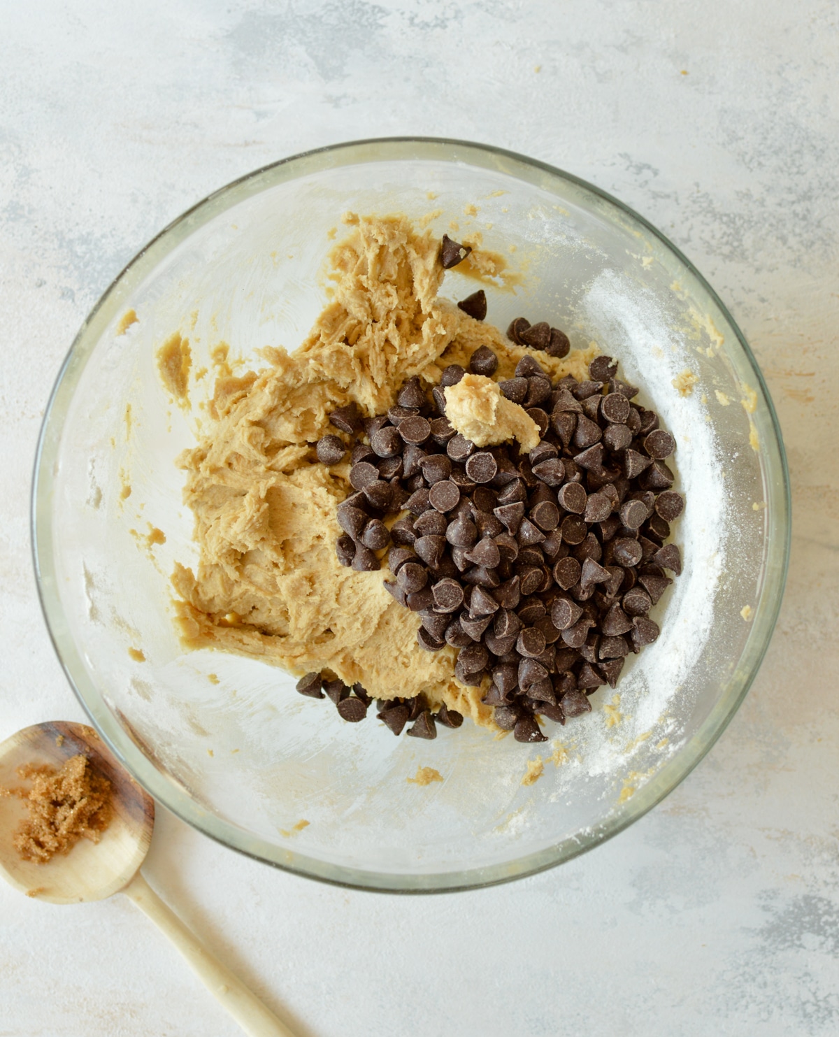 a bowl of cookie dough with chocolate chips on it