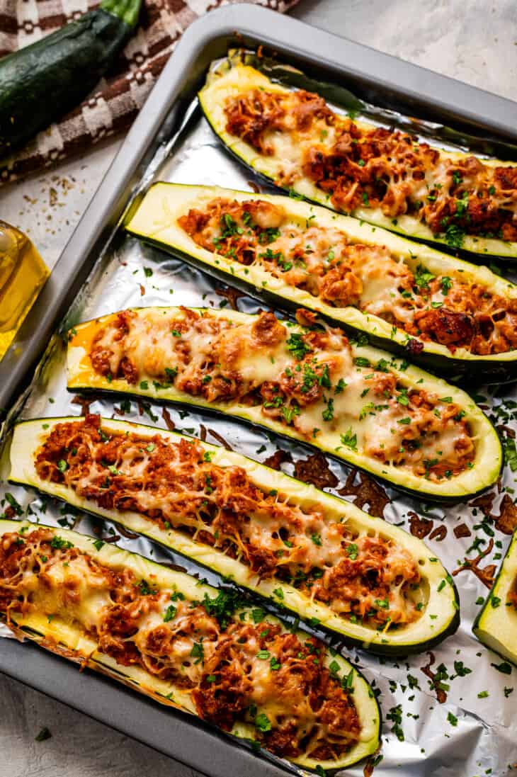 zucchini with sausage and cheese in them