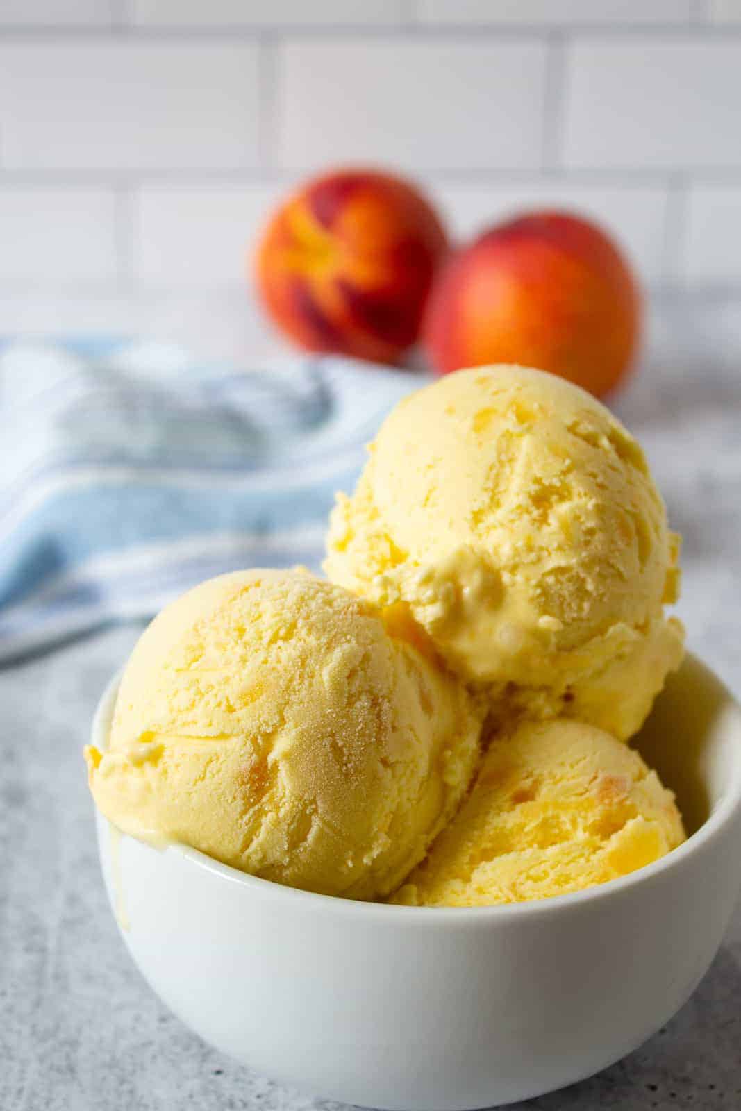 a triple scoop of peach ice cream