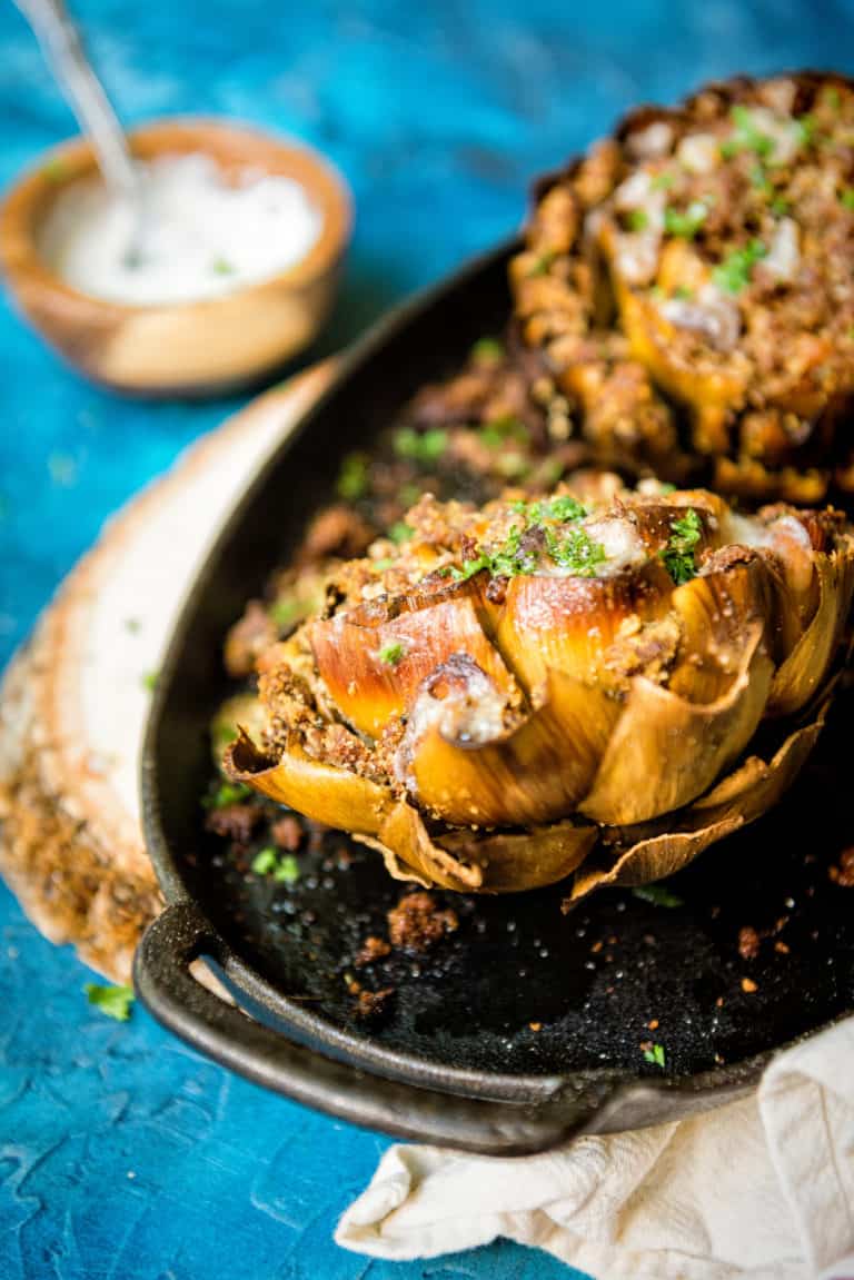 a cooked artichoke with breadcrumbs and sausage