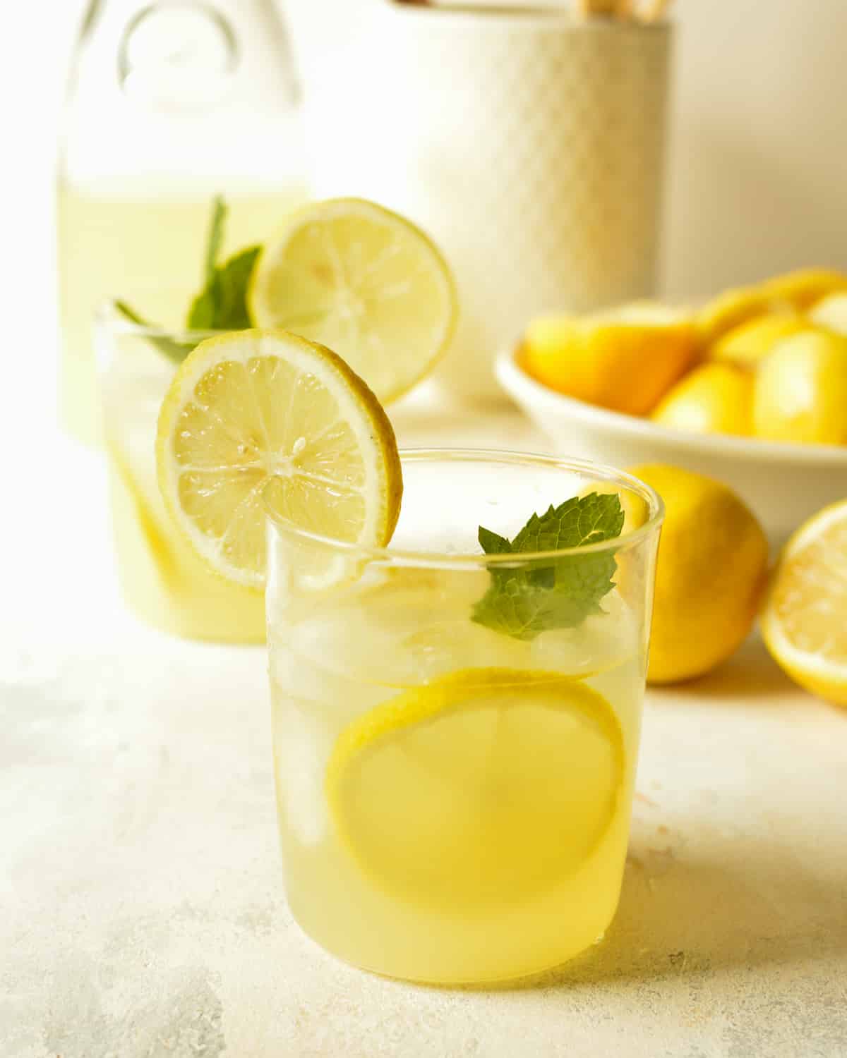 a cup of agave lemonade with mint