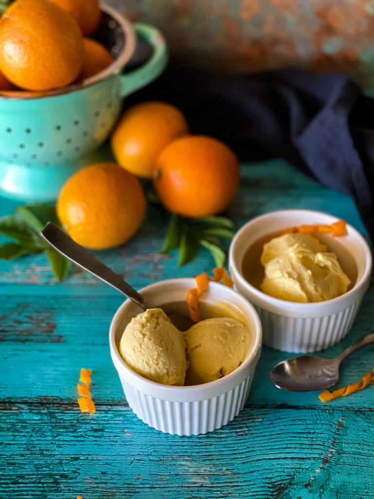 a cup of orange creamsicle ice cream