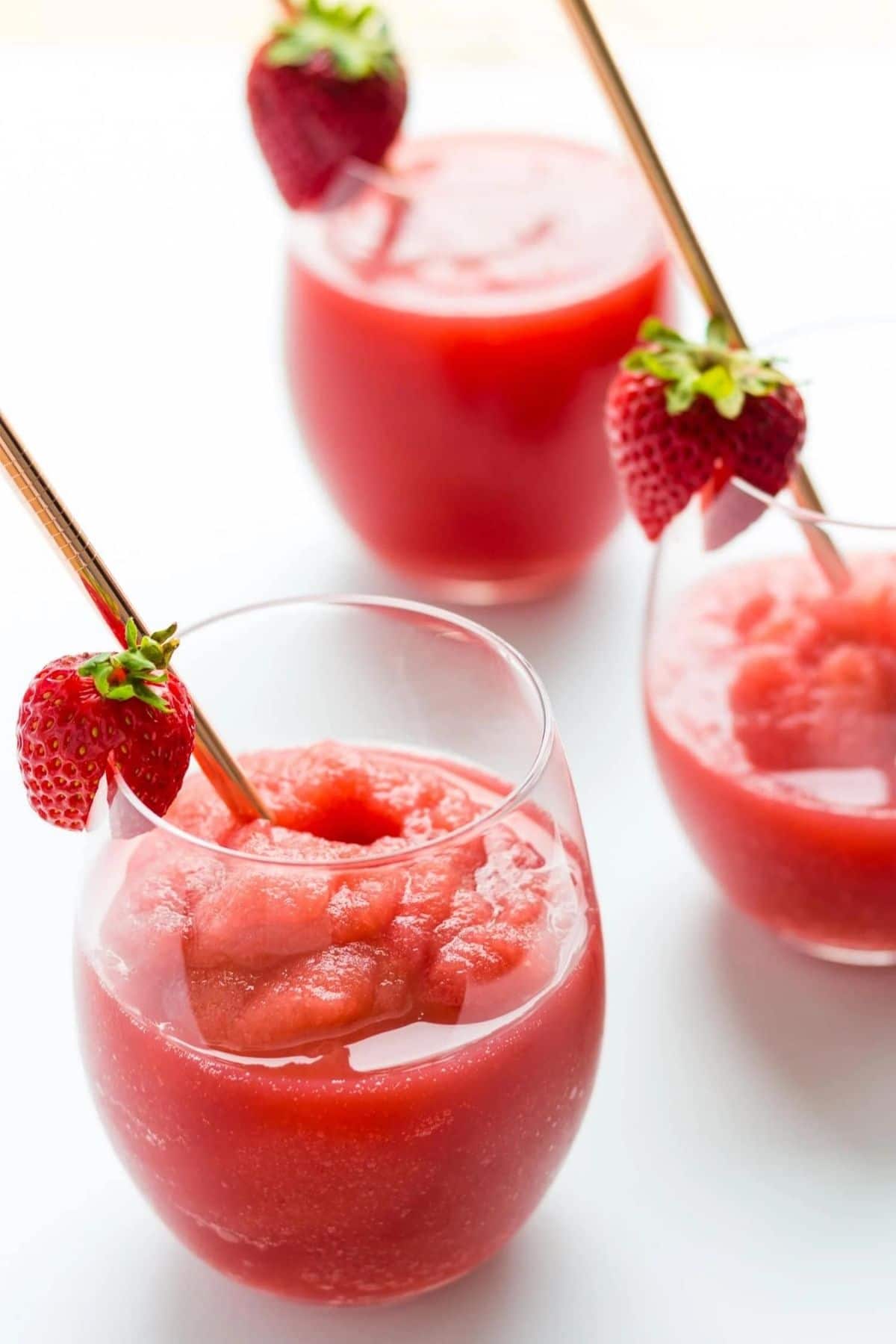 three glasses of strawberry slushies