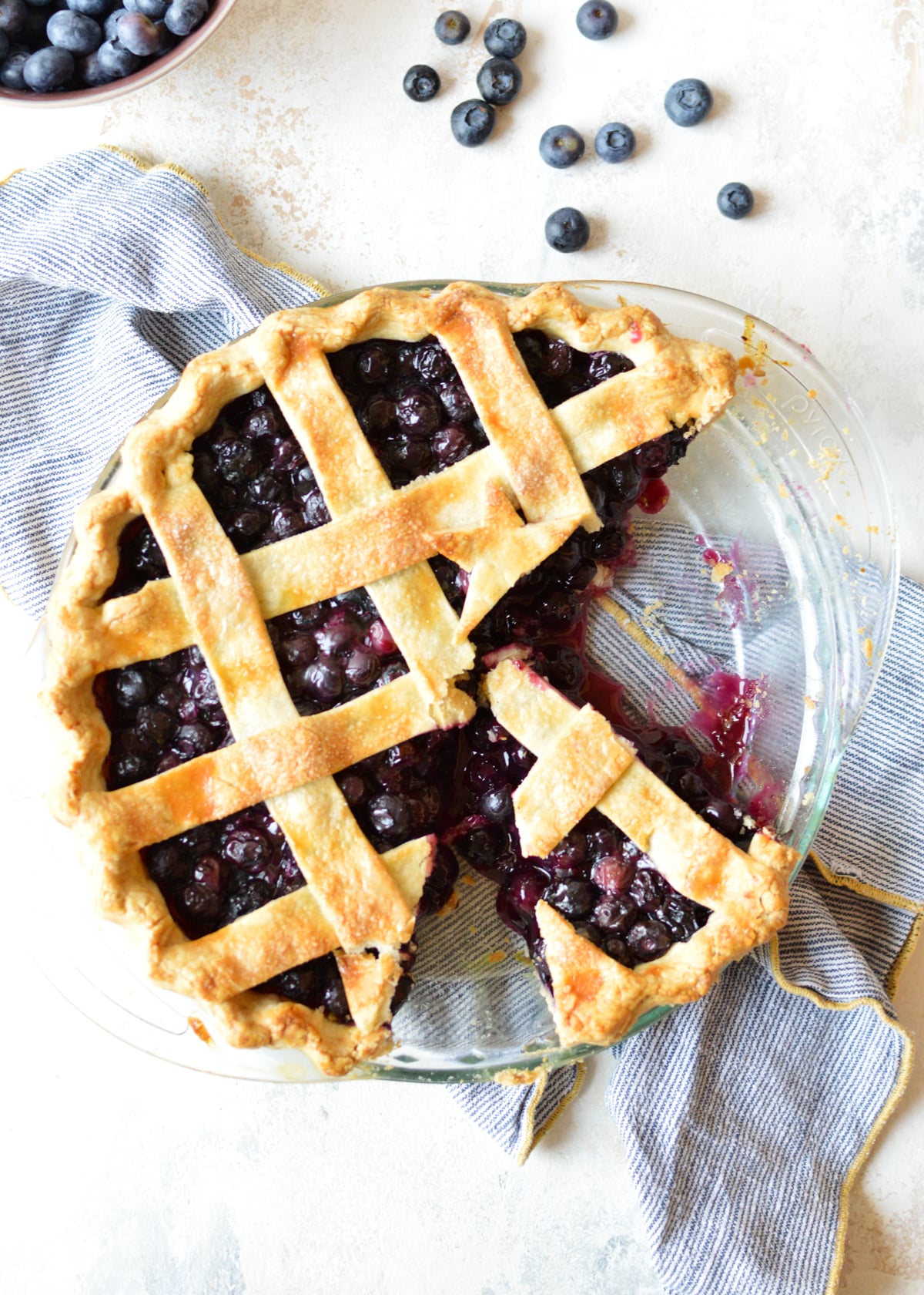 gluten free blueberry pie with a slice cut out