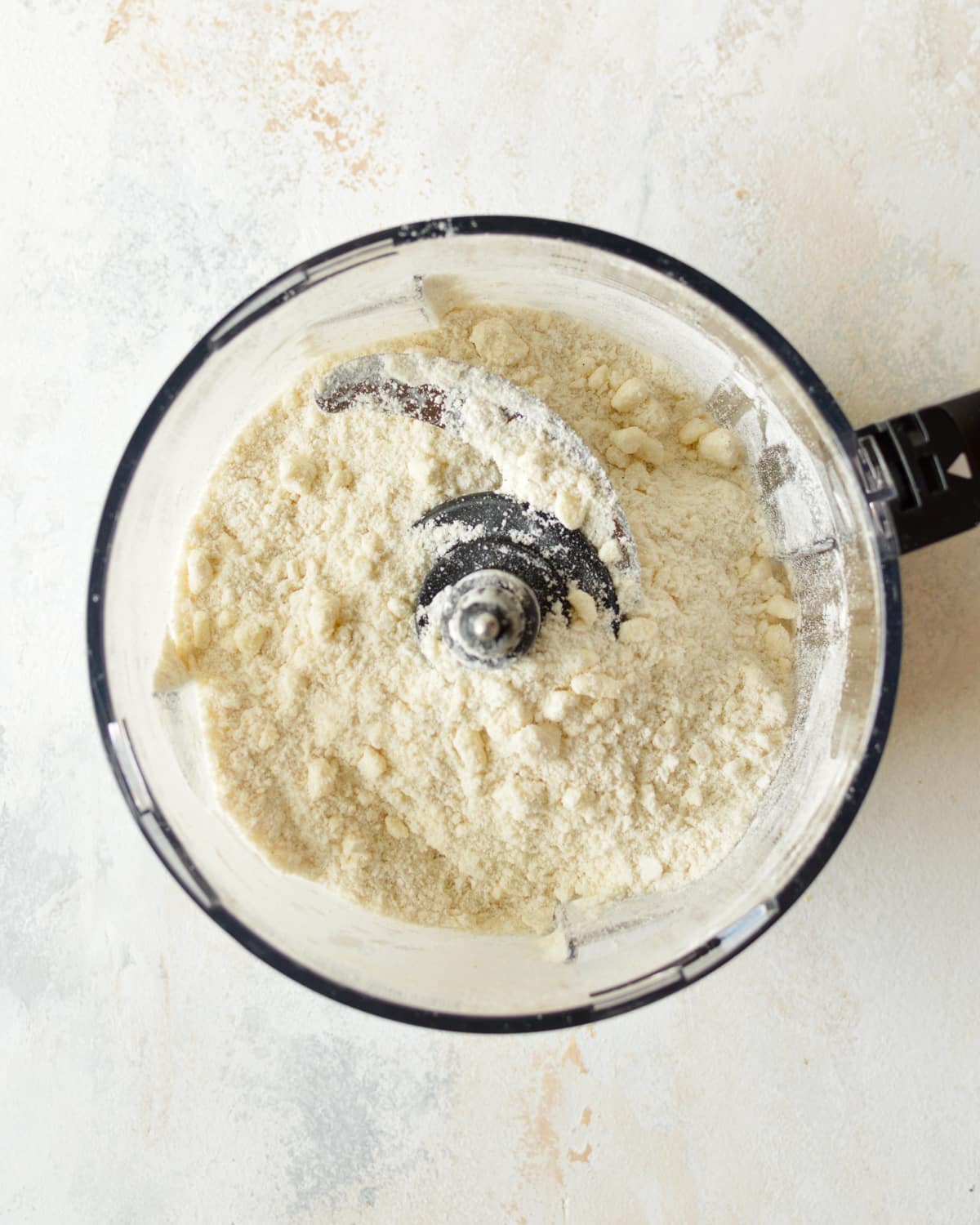 butter, flour, sugar, and salt in a food processor