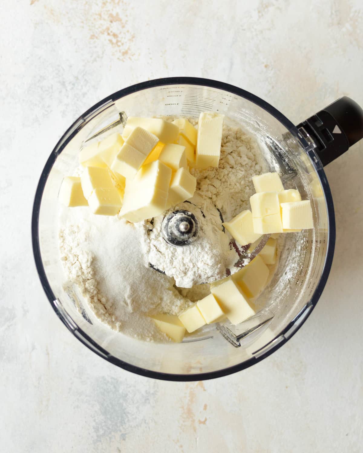 flour, sugar, salt, and butter in a food processor