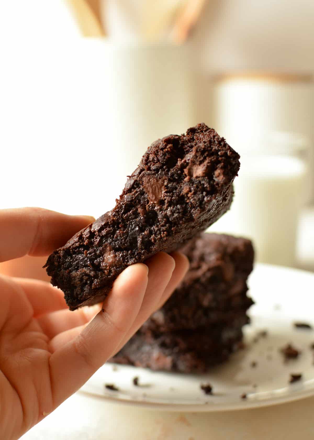 hand holding a gluten free fudge brownie