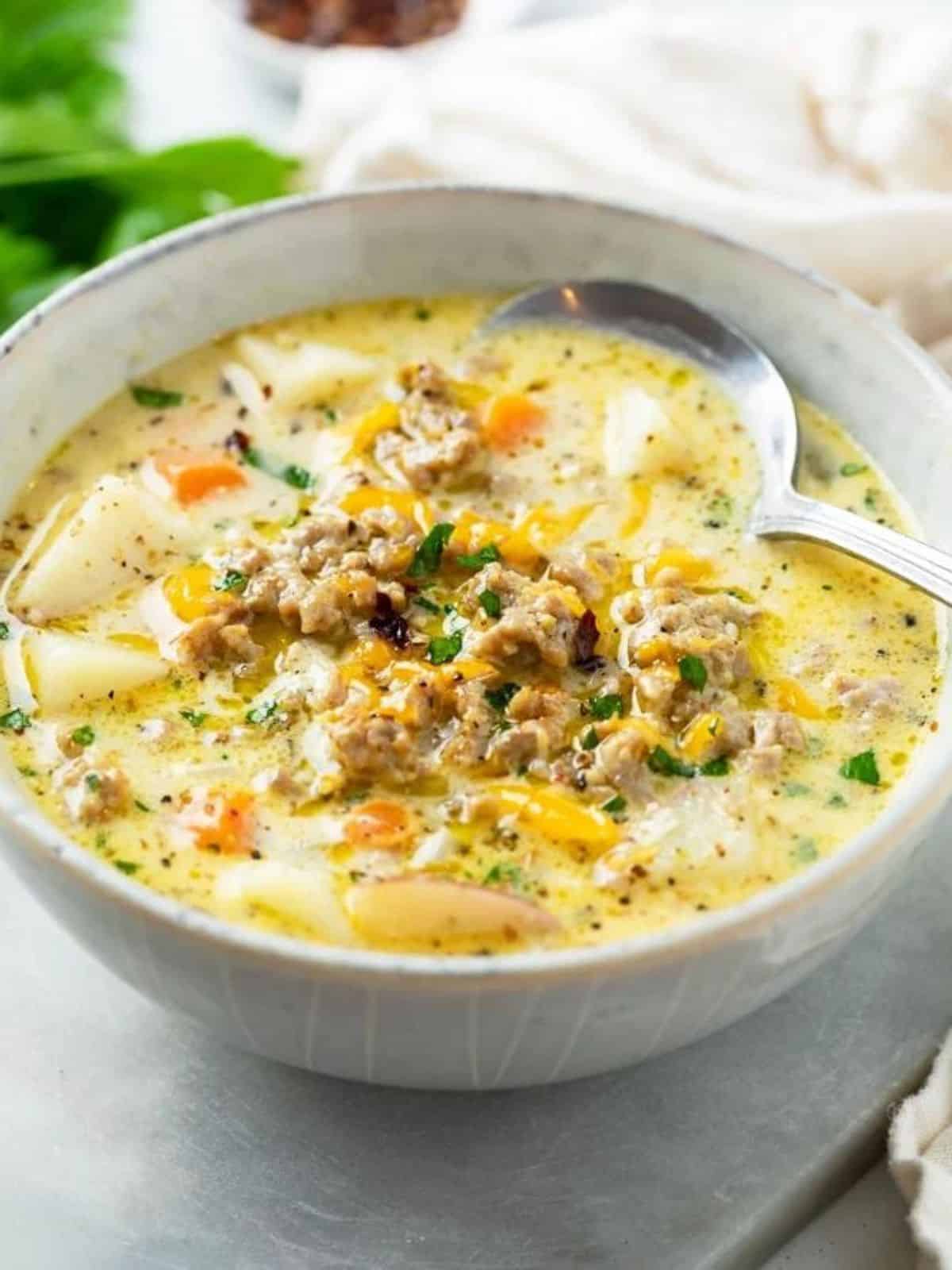 a bowl of sausage potato soup