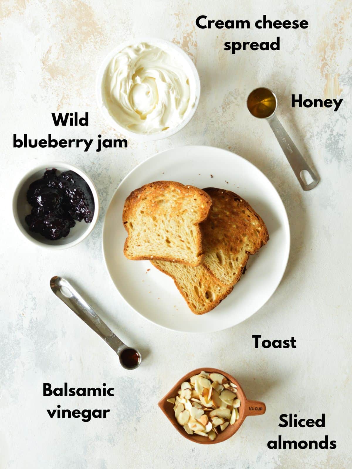 cream cheese, honey, blueberry jam, toast, honey, and almonds