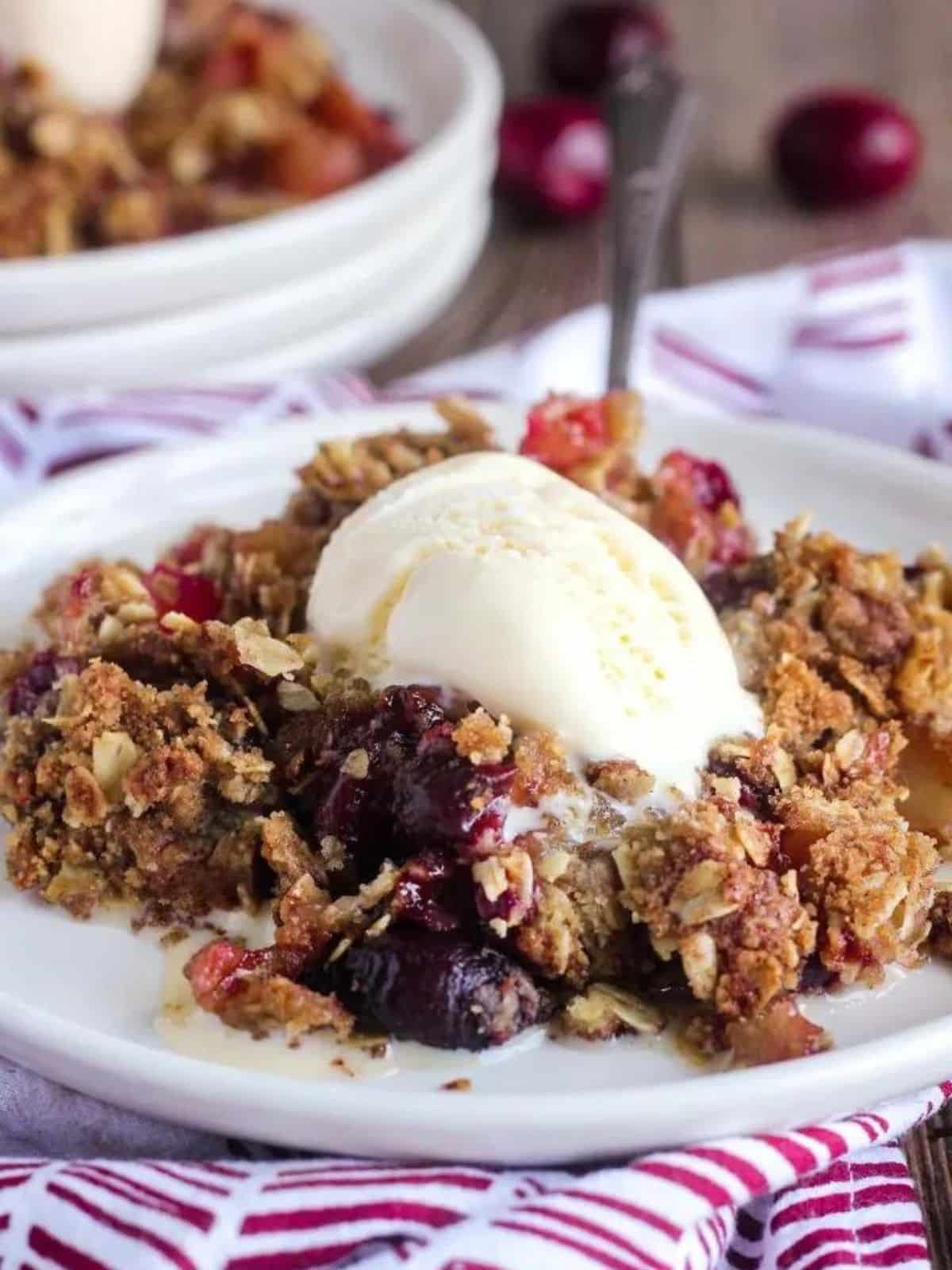 a cherry apple crisp with vanilla ice cream on top