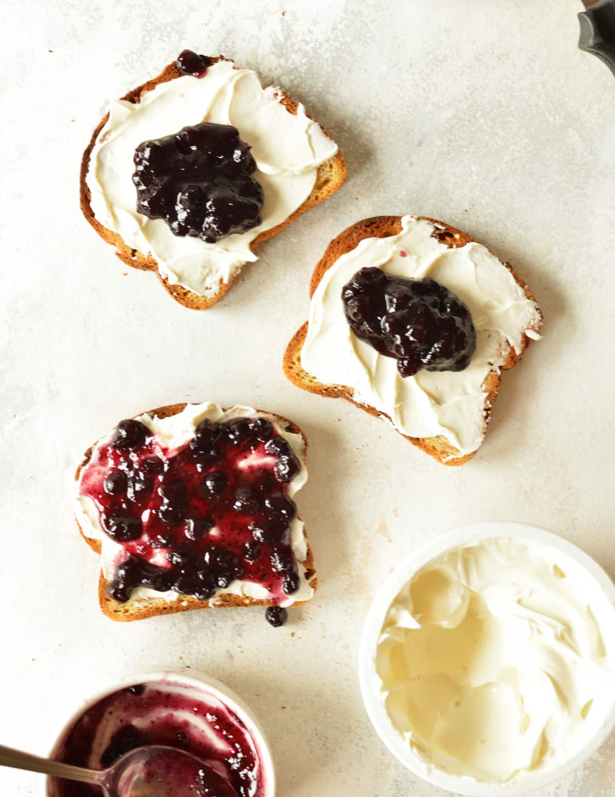cream cheese and blueberry jam on toast