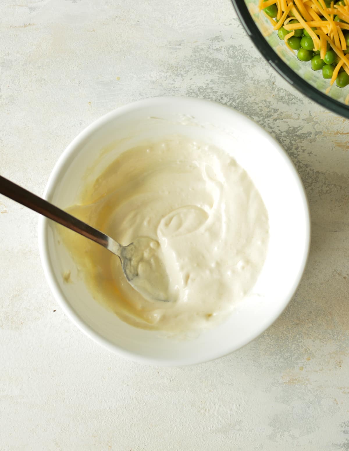 a small bowl of mayo-based dressing