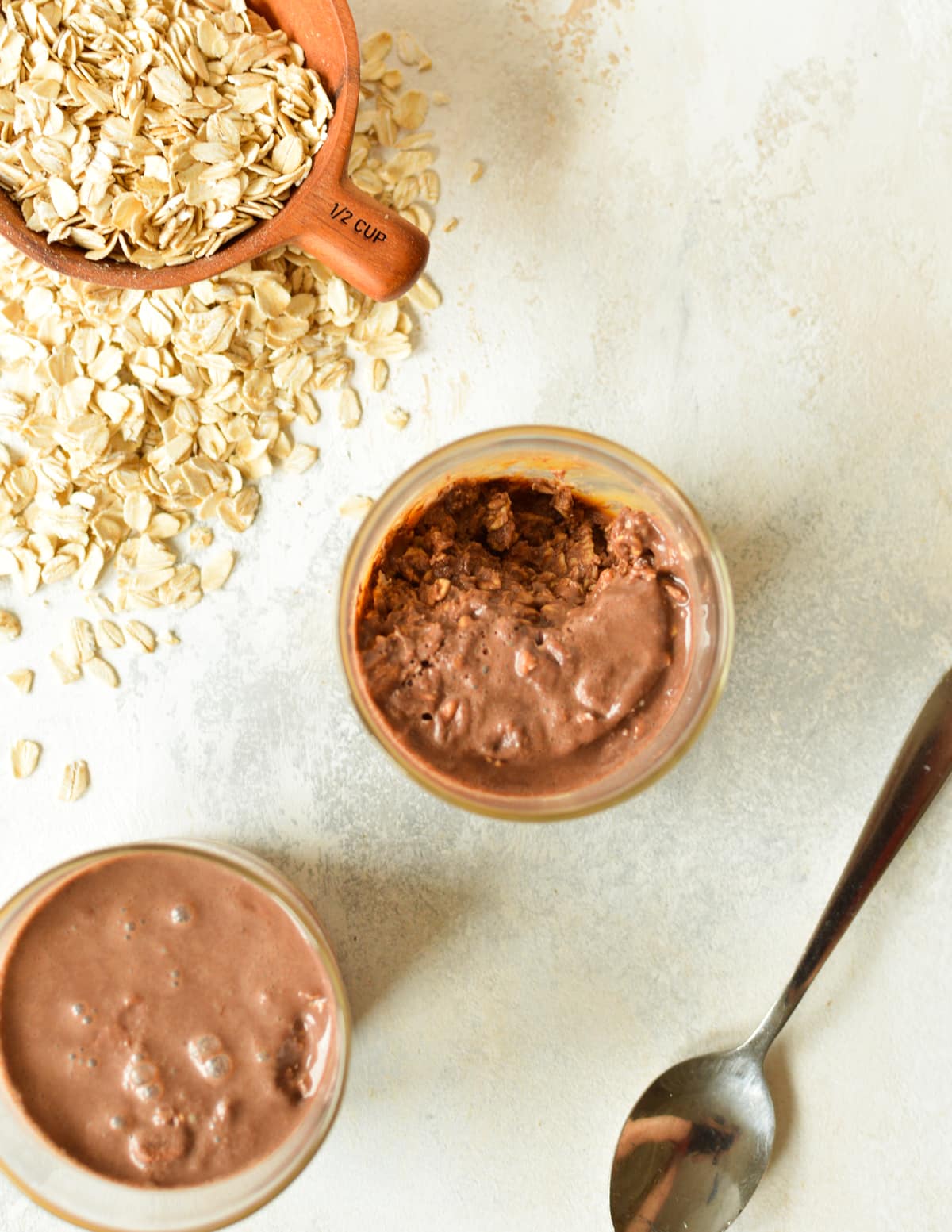 two glasses of chocolate protein overnight oats