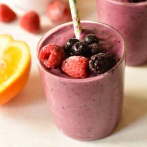 a berry smoothie with berries on it